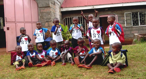 Kenyan Group - children sitting and standing in a group photo.
